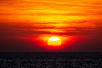 Fiery Sunset with Vivid Orange and Red Sky