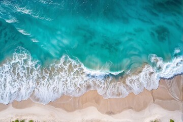 Fototapeta premium Aerial View of Turquoise Waves Crashing on Sandy Beach