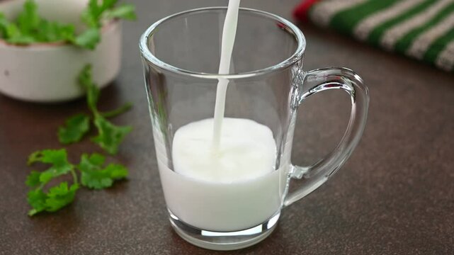 Serving buttermilk in a glass cup.