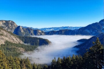 Fototapeta premium Misty Valley Surrounded by Majestic Mountain Peaks