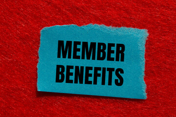 Member benefits message written on ripped torn blue paper piece with red background. Conceptual member benefits symbol. Copy space.