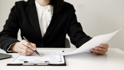 Business woman employer holding resume hiring recruit looking cv resume to hire candidates, analyzing information before job interview. Recruitment concepts