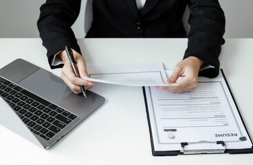 Business woman employer holding resume hiring recruit looking cv resume to hire candidates,...
