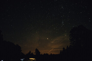 Naklejka premium Starry night with the reflection of the northern light.