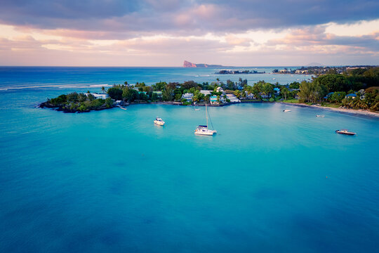 Drone view of the greater Grand Baie area on Mauritius, with its beautiful estates and beaches, Cap Malheureux and Gunner's Quoin in the background