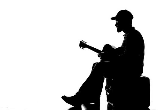 recommend clip art: Black Silhouette of a street performer playing guitar for tips on a white background.