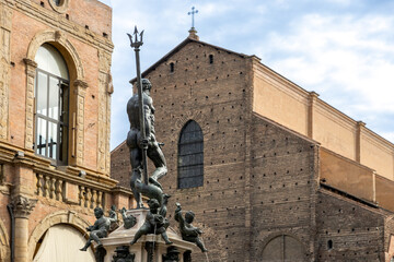 Fountain of Neptune and Basilica of San Petronio in Piazza Maggiore, showcasing Bologna's historic architecture, Italy © cabuscaa