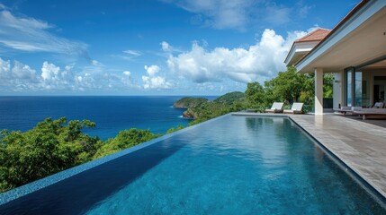 Fototapeta premium Seaside villa with an infinity pool overlooking the ocean, no people. Ample room for text in the surroundings.