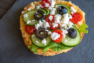 Mediterranean Hummus Toast with Cucumber, Tomato, Olive, and Feta - Close-Up