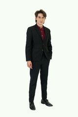 A man dressed in business suit stand confidently, looking professional. Portrait on white background with studio light. Isolated