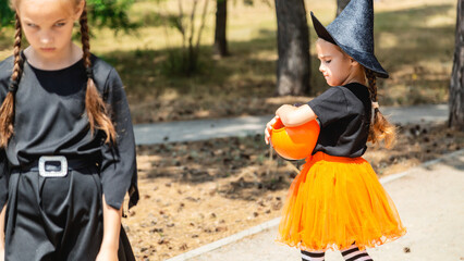 Obraz premium Happy kids at Halloween party. Children are wearing carnival costumes.