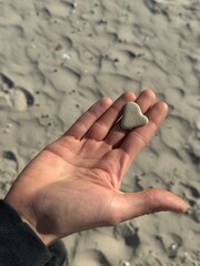 person holding a stone