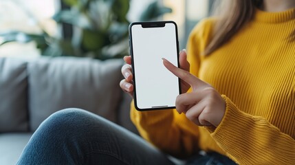 Close up of mature hand holding smartphone with blank screen isolated on while background. Black woman showing empty screen of modern cellphone. Mature hand showing white screen of smart phone