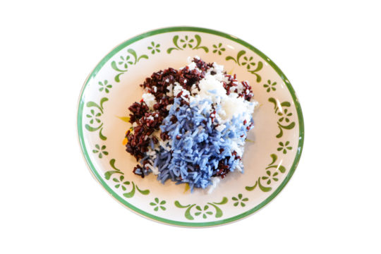 Three-color rice dark brown, white, purple in white tiled dish luxurious isolated on cut out PNG or transparent background. Tasty Cooked rice. Jasmine rice is famous in Thailand for its fragrant aroma