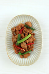 Close Up Stir Fry Spicy Chicken Chunky on Ceramic Plate