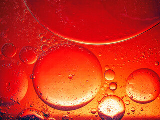 Abstract Background Red oil Macro Colorful artistic of oil drop floating on the water. macro red bubble oil of wallpeper, blood concept