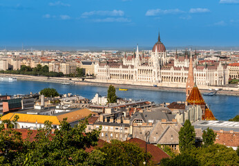 Obraz premium Budapest, Hungary. August 26, 2022. Aerial view of the parliament. Overlooking the Danube it stands out from the rest of the landscape. Beautiful summer day.