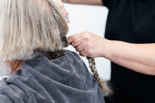 Person donates hair for charitable causes