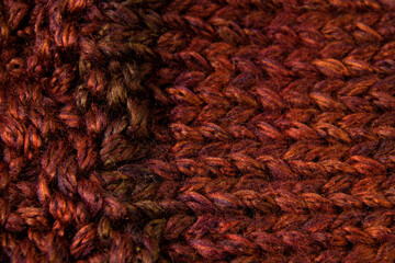 Fragment of very thick wool texture in maroon color with interlaced white thread