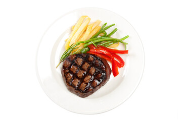 Overhead view of white plate with hamburger and vegetable garnish on white background