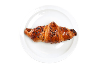 Overhead shot of chocolate croissant with sprinkles on plate on white background