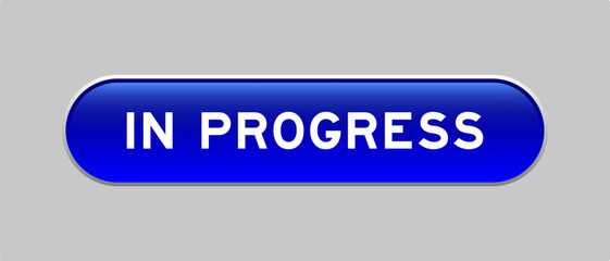 Fototapeta premium Blue color capsule shape button with word in progress on gray background