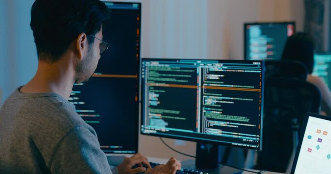 Group Adult Asia male, female freelance typing write prompt AI bot IT app smart program nomad, video game, terminal with coding language, designer, big data center on desktop computer in night office.