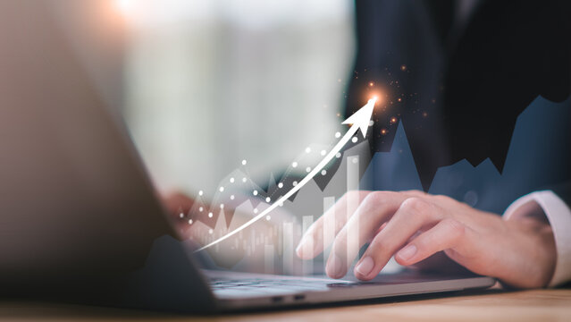 Businessman showing business growth and success graph ,concept of progress in development, financial efficiency and investment with business strategy for goals and opportunities in the industry future