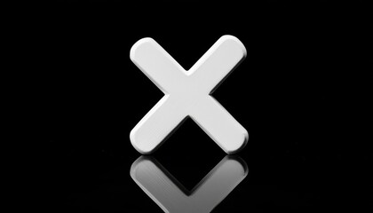 Obraz premium A large white X shape with a smooth surface standing against a black background with a reflective surface