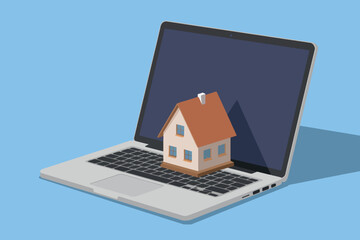 Miniature house on laptop keyboard, real estate and mortgage concept.