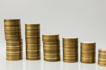 Stack of coins on gray . money finance business concept. large number of coins are in stack on a gray . a stack of coins on a gray with a large number of coins lifestyle on it.