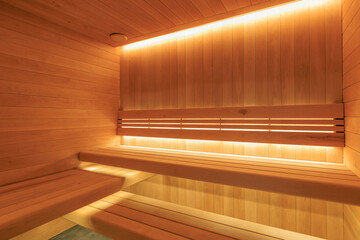 Obraz premium Finnish sauna. Interior of modern Sauna room wellness and spa. Empty interior of huge sauna