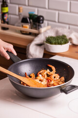 Cooking shrimp in a frying pan