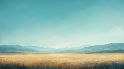 A vast golden field stretches toward distant mountains under a clear, soft blue sky.