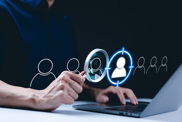 Target customer concept. CRM, Customer relationship management, A person using a laptop with...