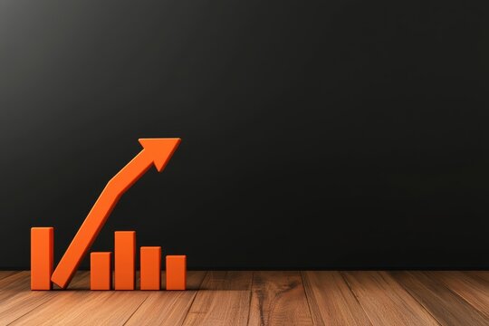 Orange growth chart on wooden floor against a black background, representing progress.