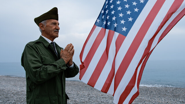 Old Veteran Making A Prayer For His Lost Partners In War