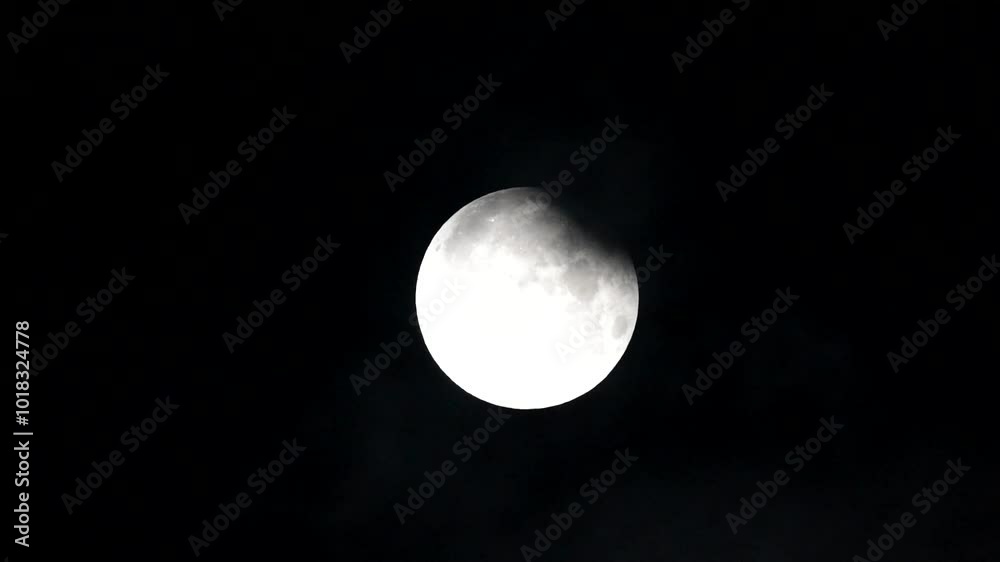 Canvas Prints partial lunar eclipse full moon and lunar eclipse full moon between the clouds super moon 2024