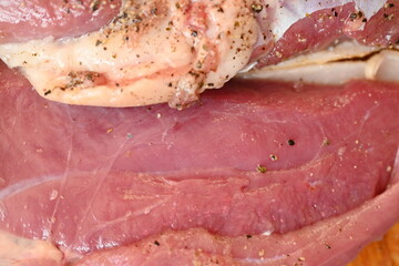 Texture of fatty fresh duck breast close up as background, texture of black meat of duck breast close up photo from above 