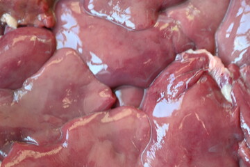 close-up texture of fresh chicken liver, chicken liver for cooking, source of iron vitamins, trace elements, healthy food, offal for cooking