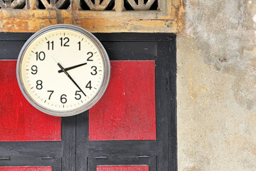 Analog Clock Hanging on Red Wooden Door.