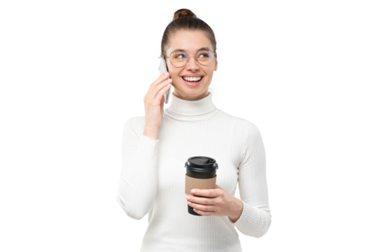 Portrait of modern millennial student girl wearing glasses, talking on the phone, holding takeaway coffee cup in hand