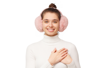 Kind young woman in pink earmuffs holding hands on chest, showing deep sincere gratitude, care, respect and love