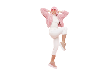 Full length portrait of young happy girl wearing funky clothes and glasses, dancing and laughing, lifting knees and jumping