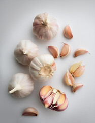  garlic cloves, isolated on a clean white background