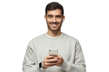 Young man standing, looking at camera with smile, holding phone with both hands
