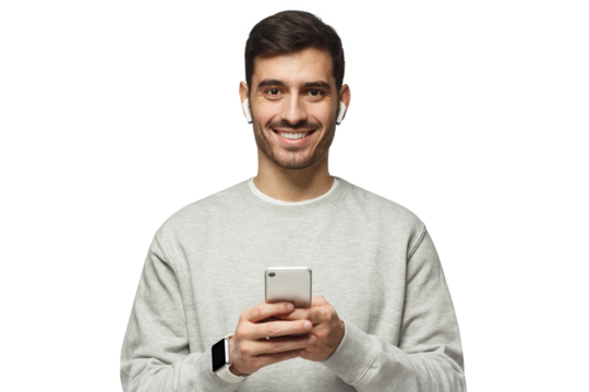 Young man standing, looking at camera with smile, holding phone with both hands