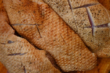  fresh duck breast with skin sliced for baking, top photo of duck breast skin texture as background, preparation for cooking, healthy home cooking, preparation for restaurant, 