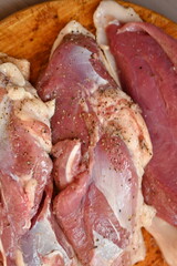 Texture of fatty fresh duck breast close up as background, texture of black meat of duck breast close up photo from above 