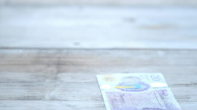 Woman counting Great Britain Pound banknotes, Close-up feminine hands sorting British currency, financial planning and budgeting, business transactions or financial success